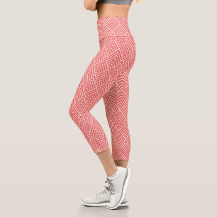 a red and white background with a pattern capri leggings