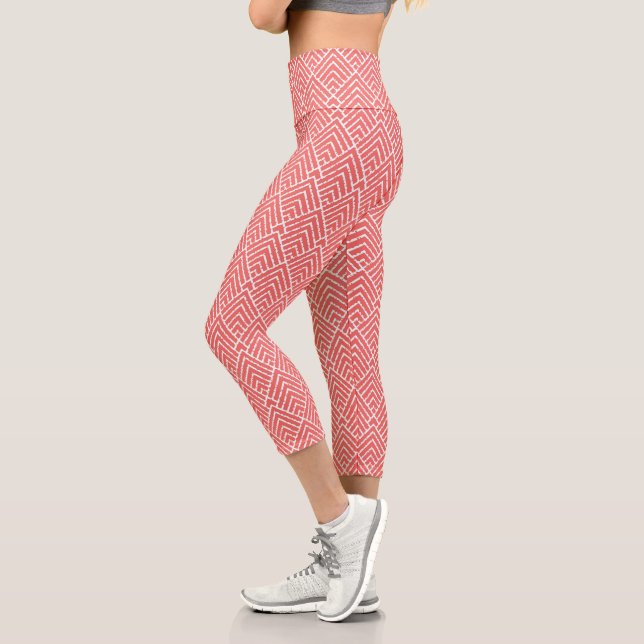 a red and white background with a pattern capri leggings (Left)