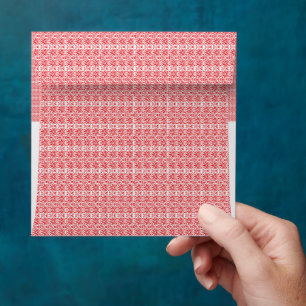 a red and white background with a pattern envelope