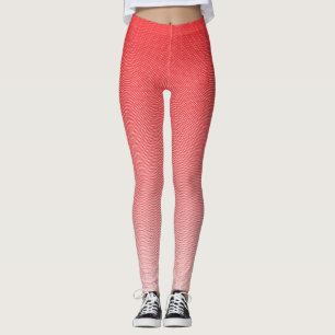 a red and white background with small squares leggings