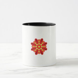 a red and yellow flower with black dots mug