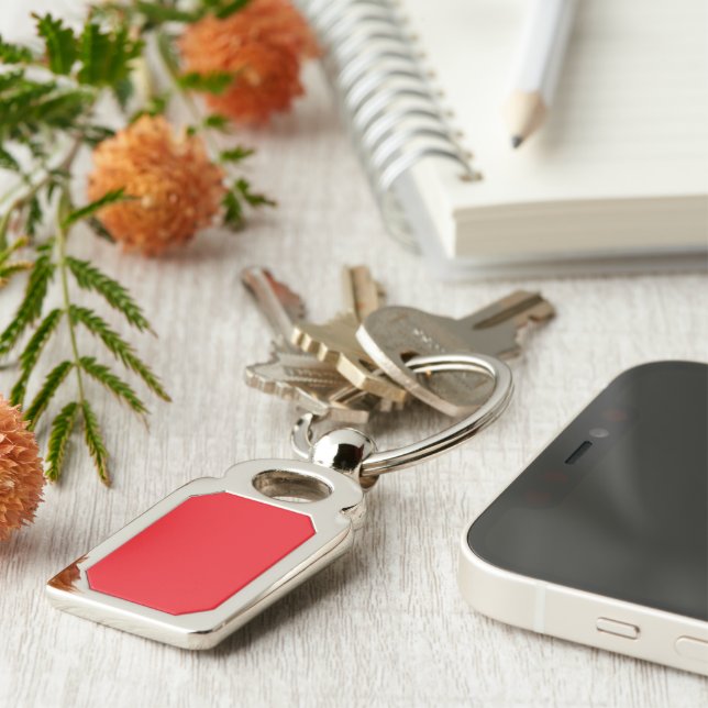 a red background with a black border key ring (Side)
