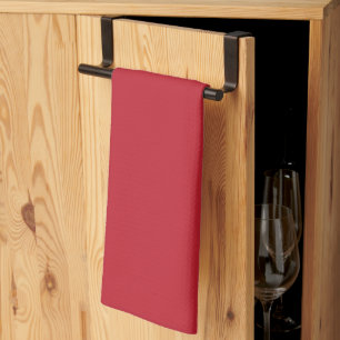 a red background with a tea towel