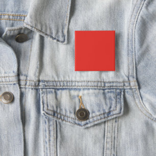 a red background with a white border 15 cm square badge