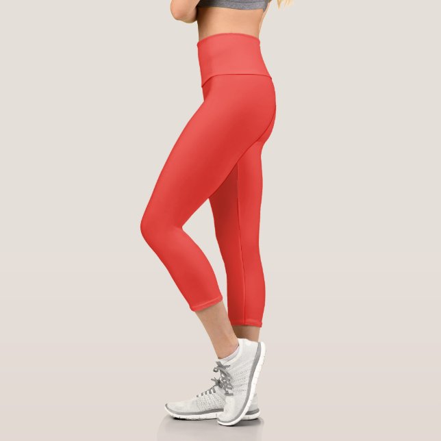 a red background with a white border capri leggings (Left)