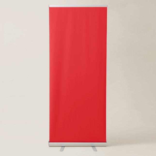 a red background with a white border retractable banner (Front)