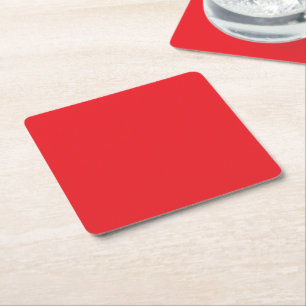 a red background with a white border square paper coaster