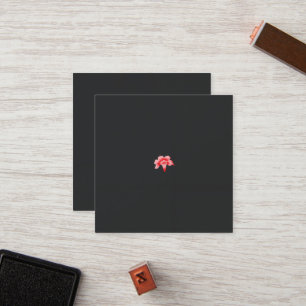 a red flower on a black background loyalty card