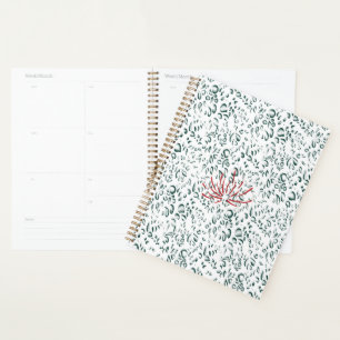 a red flower on a black background planner