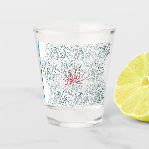 a red flower on a black background shot glass