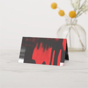 A red graphic design featuring bold geometric shap place card