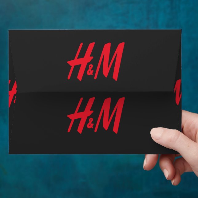 a red h and m logo on a black background envelope (Hand)