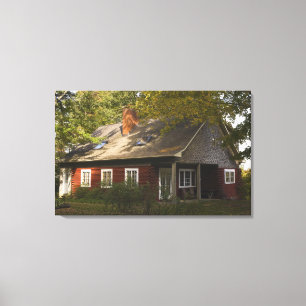 A Red Log Home Canvas Print
