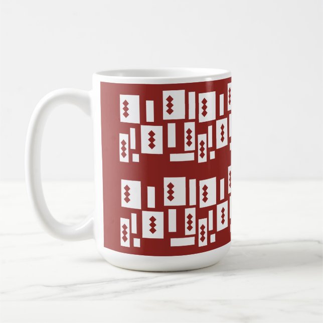 A red rug with a textured pattern is spread out on coffee mug (Left)