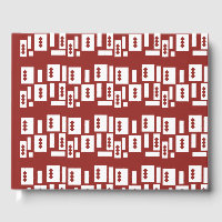 A red rug with a textured pattern is spread out on