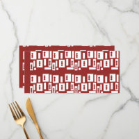 A red rug with a textured pattern is spread out on