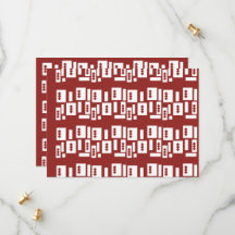 A red rug with a textured pattern is spread out on