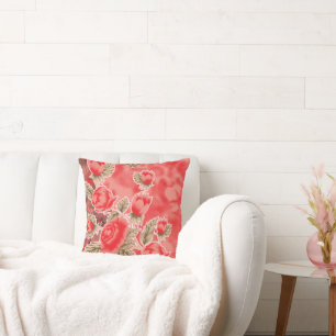 a red scarf with flowers on it cushion