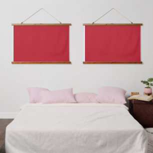 A red square enclosed by a thin white border, crea hanging tapestry