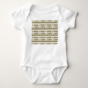 A richly coloured rug features a symmetrical geome baby bodysuit
