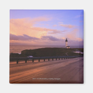 A Road & A Lighthouse Along The Coast At Sunset Magnet