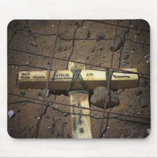 A road repair crew places a cross mouse mat