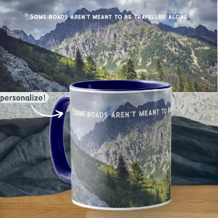 A rocky trail towards high mountain peaks mug
