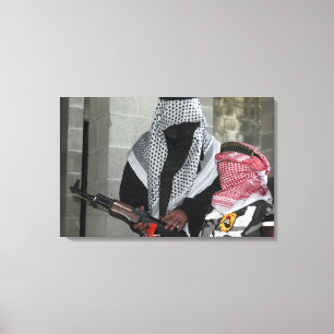 A role-playing enemy aggressor arms a dummy canvas print
