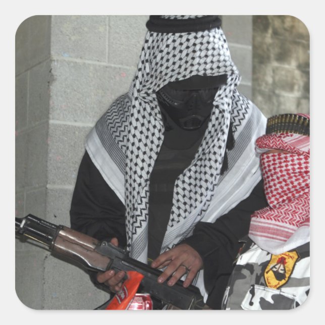 A role-playing enemy aggressor arms a dummy square sticker (Front)