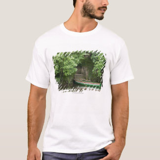 A Row Boat Roped At Some Stairs Along The Shore T-Shirt
