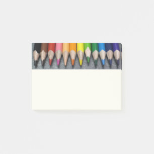 A Row of Coloured Pencils. Post-it Notes