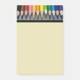 A Row of Coloured Pencils. Post-it Notes