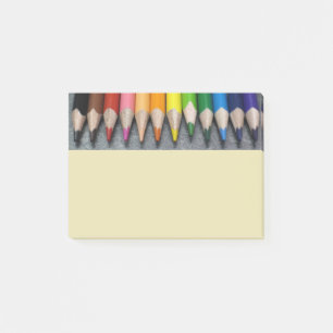 A Row of Coloured Pencils. Post-it Notes