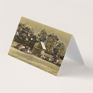 A row of jalopies in the grass.