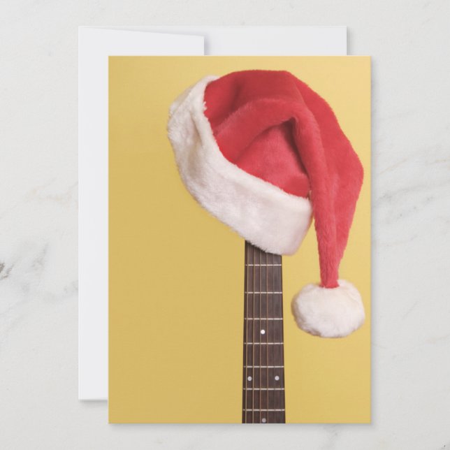 A Santa hat hangs on an acoustic guitar Holiday Card (Front)