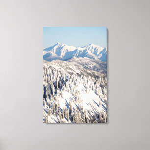 A Scenic View of Snowy Mountains and Trees. Canvas Print