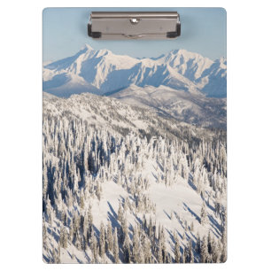 A Scenic View of Snowy Mountains and Trees. Clipboard