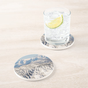 A Scenic View of Snowy Mountains and Trees. Coaster