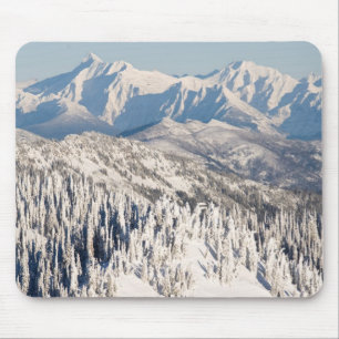 A Scenic View of Snowy Mountains and Trees. Mouse Mat
