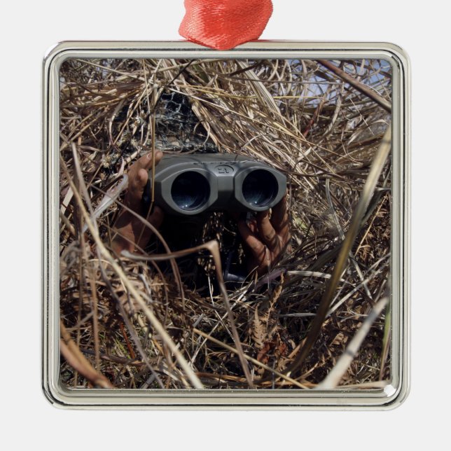 A scout observer practices observation techniqu 2 metal tree decoration (Front)