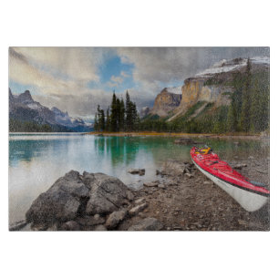 A sea kayak ashore at Spirit Island Cutting Board