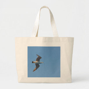 A seagull in flight on Tote Bag