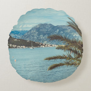 A Seascape with Mountains and a Palm Tree Round Cushion