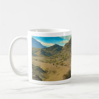 A serene desert valley coffee mug
