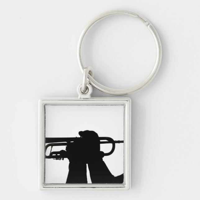 A service member plays a tune key ring (Front)