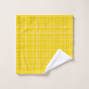 A set of bright yellow plaid towels on a silver