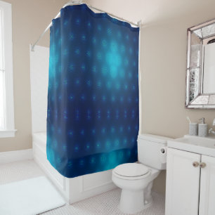 A shower curtain with a gradient blue and teal