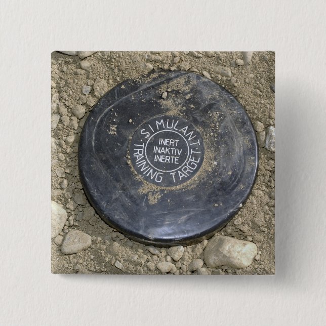 A simulated land mine 15 cm square badge (Front)