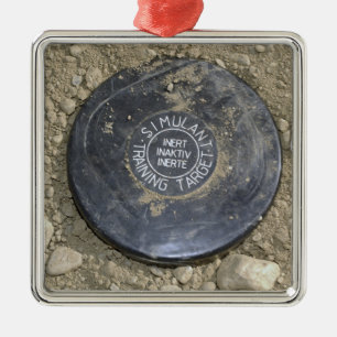 A simulated land mine metal tree decoration