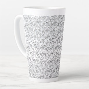 A sleek white base with a speckled pattern for a c latte mug
